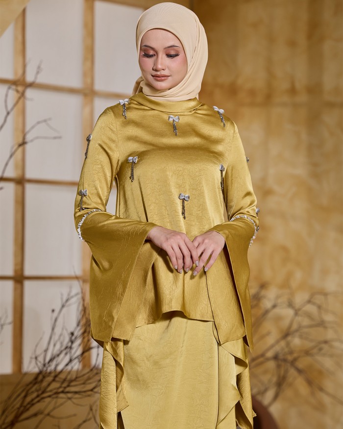 ALAIA IN GOLDEN YELLOW