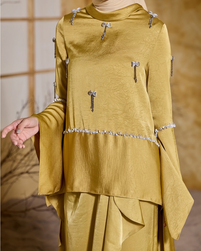 ALAIA IN GOLDEN YELLOW